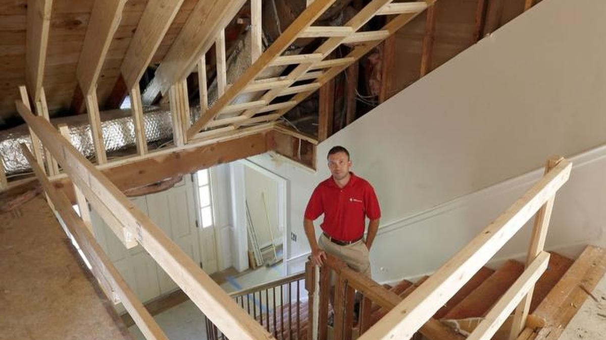 Nick Keitz, owner of Keitz Construction, stands in the new main entry which now features a vaulted ceiling leading to the top floor at the house at 1413 California Park in Lexington.