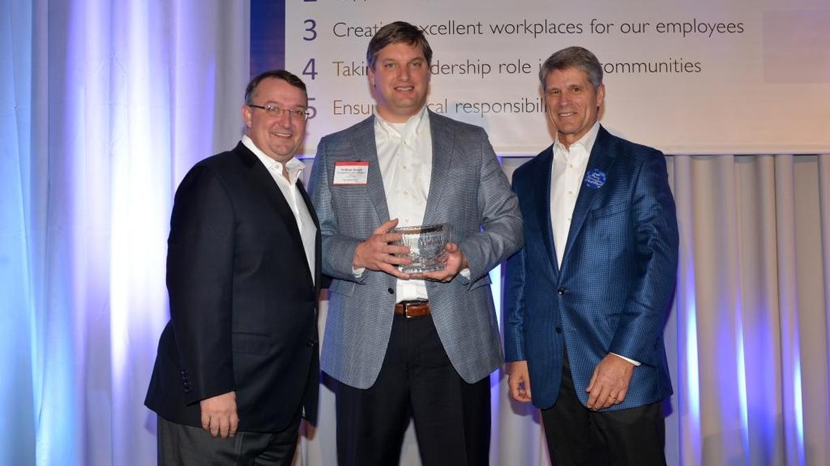William Haugh, center, Georgetown Community Hospital chief executive officer, was named CEO of the Year by LifePoint Health, the hospital’s parent company. Scott Raplee, LifePoint Health Central Group president, left, and Bill Carpenter, LifePoint Health chairman and chief executive officer, presented the award.