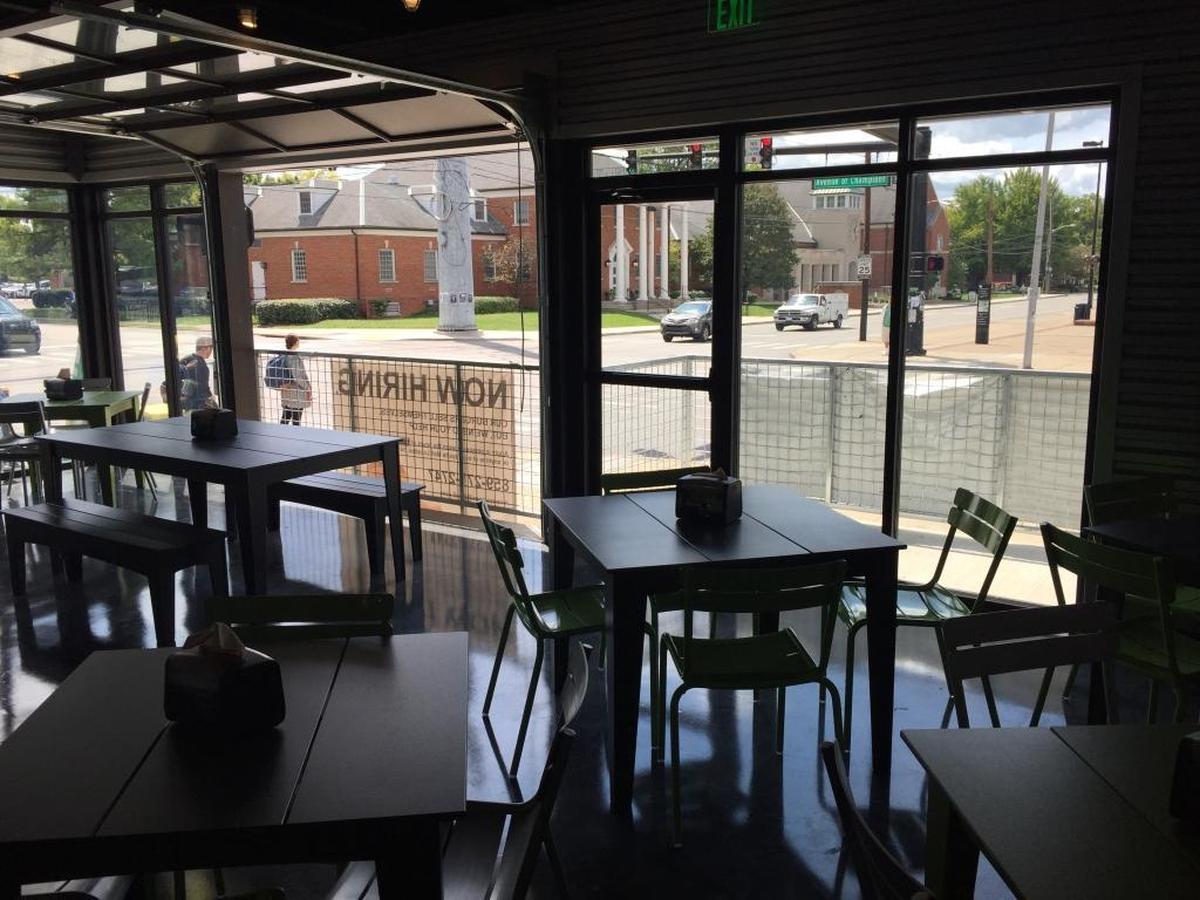 The BurgerFi restaurant in the renovated Coliseum Plaza has garage-style doors that can be opened onto the patio.