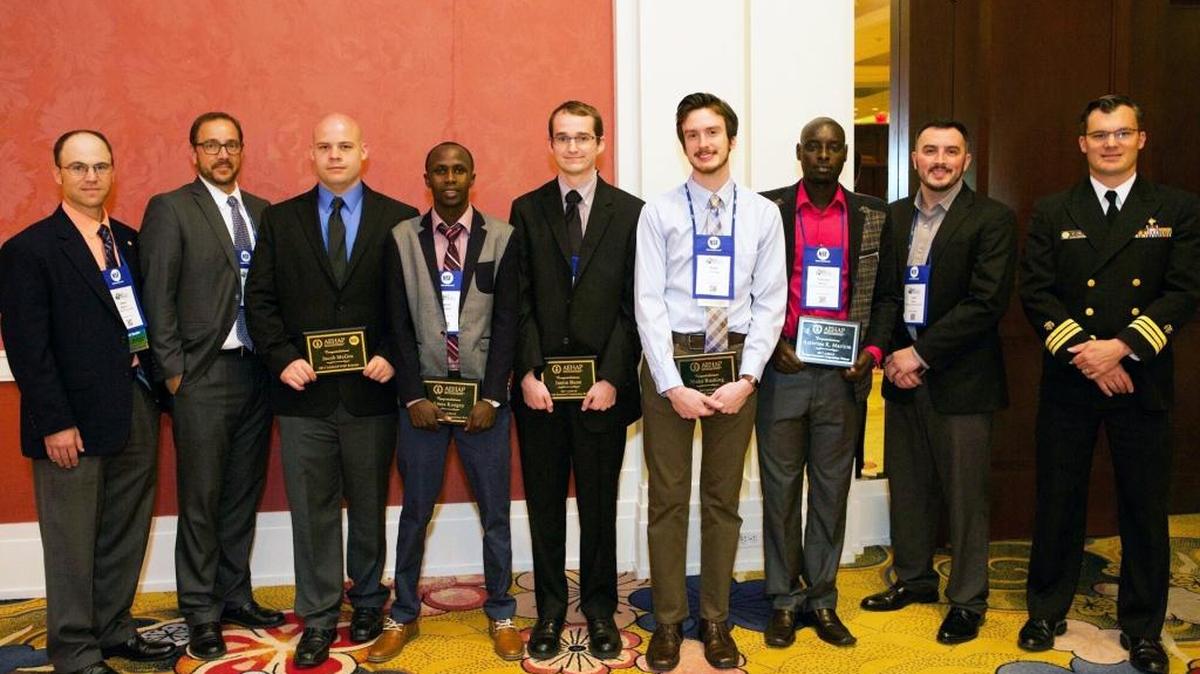 Three Eastern Kentucky University students from the Department of Environmental Health Science have been recognized by the National Environmental Health Association. From left, Jason W. Marion, EKU EHS faculty; Derek DeLand, environmental health programs manager, NSF International; Jacob McGee, EKU award recipient; Amos Kosgey, EKU award recipient; Justin Bunn, student, East Carolina University; Blake Rushing, student, East Carolina University; Ambrose Maritim, EKU award recipient; Clint Pinion, EKU EHS faculty; and CDR Jasen Kunz, U.S. Public Health Service-CDC National Center for Environmental Health.