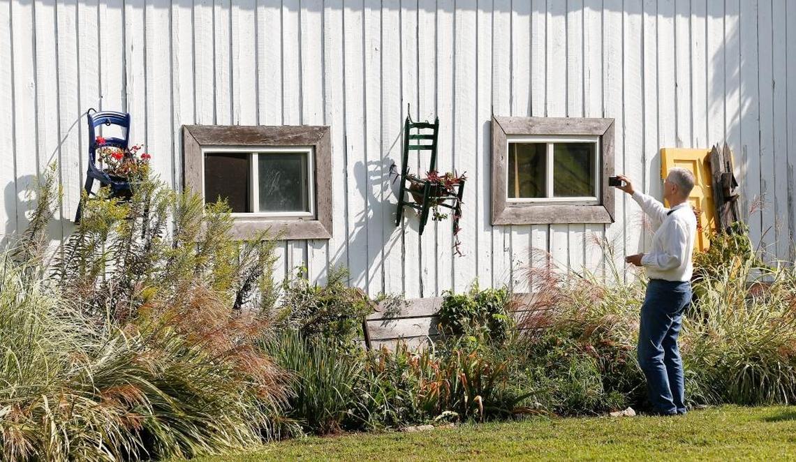 John Shuffler, Versailles, took photos of one of the barns before the auction, which failed to meet the reserve, of actor Johnny Depp's farm, 5493 Versailles Rd. on Friday.