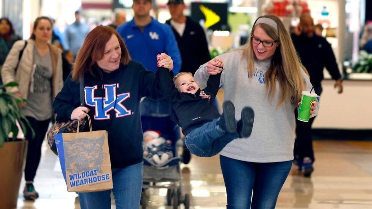 Jeffrey Kyle Bibb, 19-months-old, got a lift from his grandmother, Debbie Garrison, left, and his mom, Samantha Bibb, right, as they shopped at Fayette Mall, 3401 Nicholasville Rd. in Lexington in 2016. This year both the mall and The Summit at Fritz Farm have decided not to be open on Thanksgiving Day, although individual stores may decide to open.