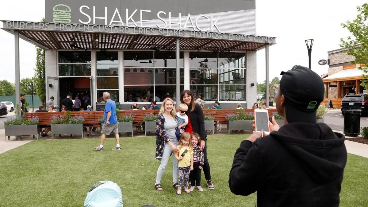 The May opening of the Shake Shack at the Summit at Fritz Farm was so popular people were having their pictures taken in front of it. Employee A.J. Pressley took a photo of Esther Hymas with her son Leo and daughter Harper, and Tamara Robinson with her daughter Sunny, shortly after the opening.