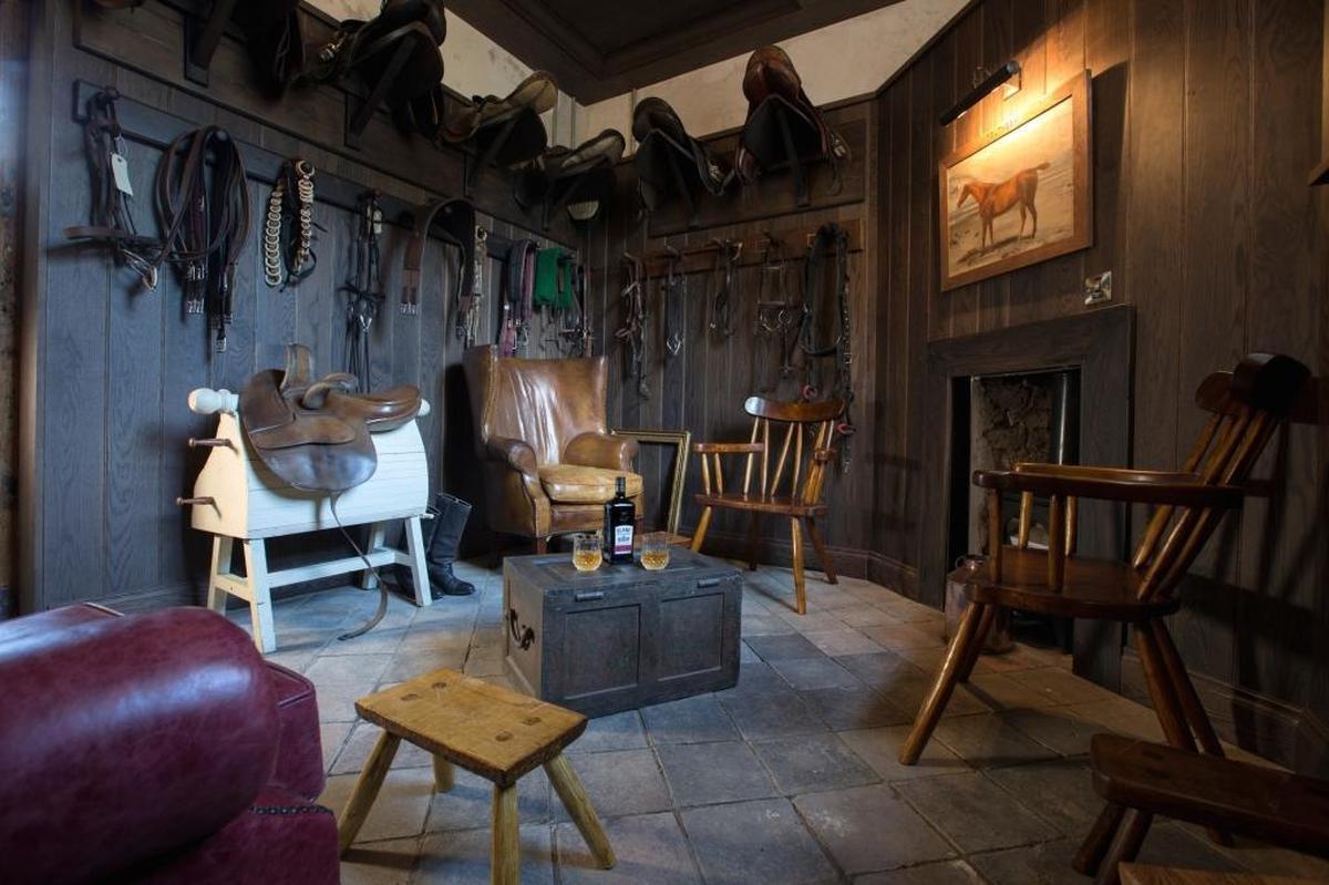 The distillery is in restored stables, which are historic, protected buildings. The visitor experience highlights the estate and the Conyngham family.