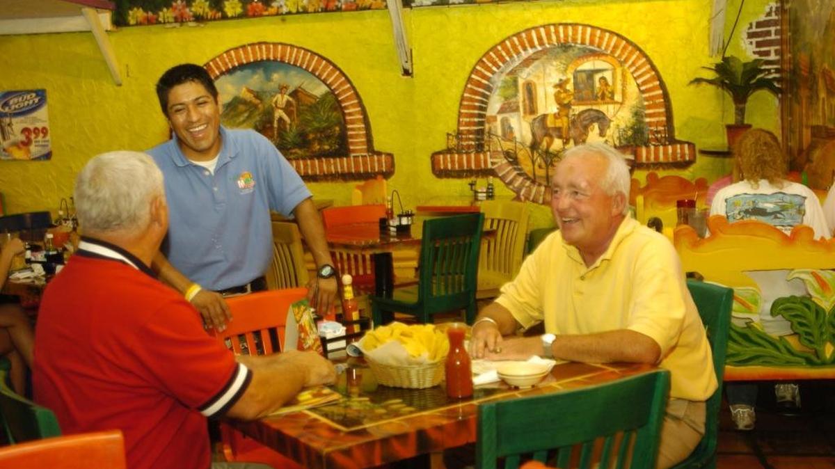 In this file photo, Luis Castillo went about his job as an assistant manager at Rincon restaurant in Lexington in 2005.