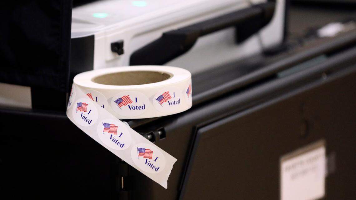 A roll of “I Voted” stickers sits next to a voting machine as voters cast their ballots at Clays Mill Elementary School on May 16, 2023, as Kentucky went the polls on primary election day across the state. Workers at this precinct said they had 40 people vote in the first two hours the polls were open.