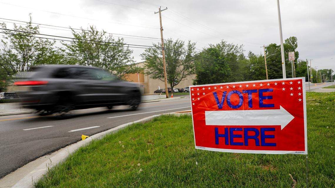 A drives past a sign outside Clays Mill Elementary school on May 16, 2023, as Kentucky went the polls on primary election day across the state. Workers at this precinct said they had 40 people vote in the first two hours the polls were open.