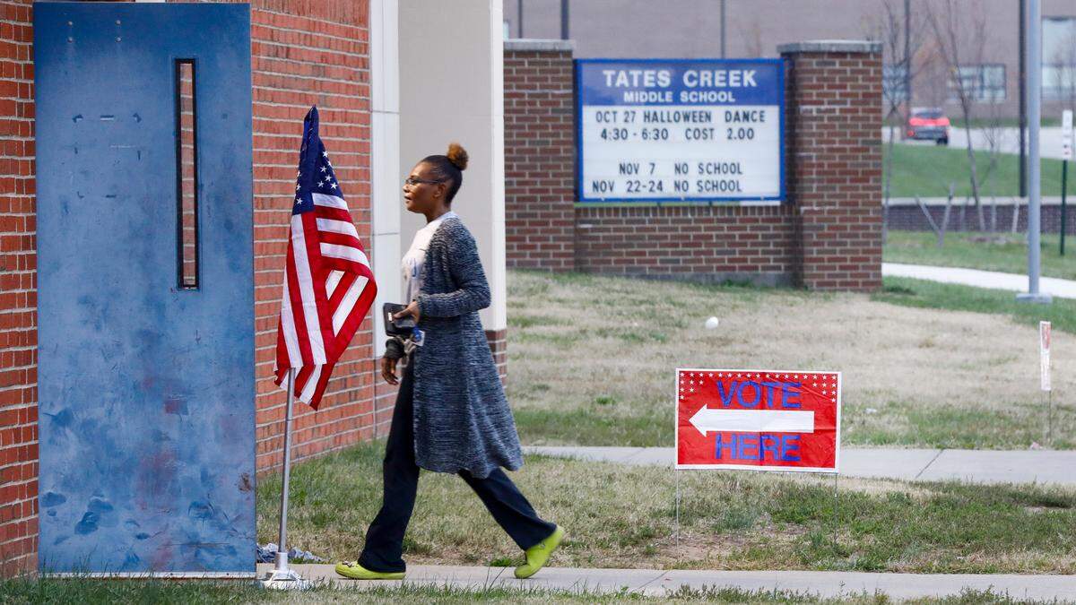 A voter walks into Kirklevington precinct at Tates Creek Middle School, Tuesday, November 7, 2023 in Lexington, Ky.to cast their ballot for the 2023 statewide general election.