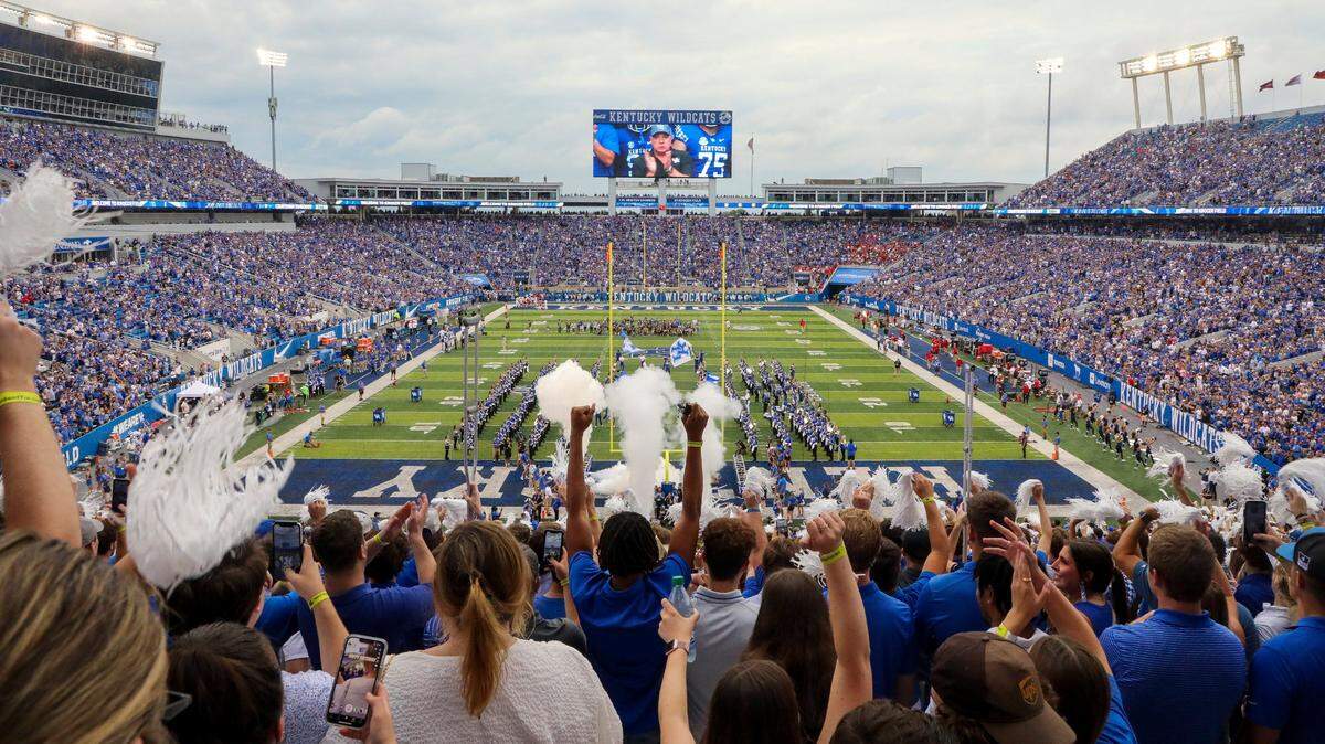 The Kentucky football team takes the field, led by head coach Mark Stoops, before a football game between Kentucky and Miami of Ohio at Kroger Field in Lexington, Ky., Saturday, Sept. 3, 2022.