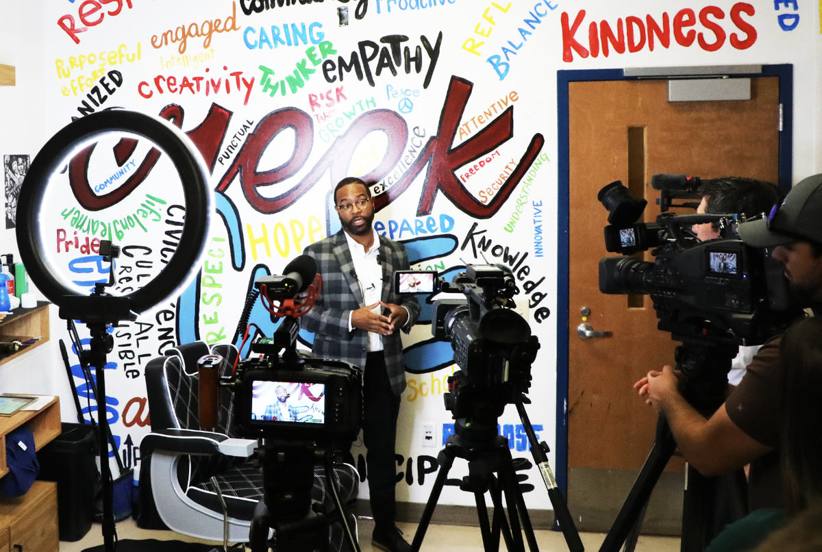 Veteran barber and owner, C.J. Carter speaks to the press during the official kick-off of his partnership program, “Sharp Futures” with Tates Creek Middle School on September 16, 2024, in Lexington, Ky.