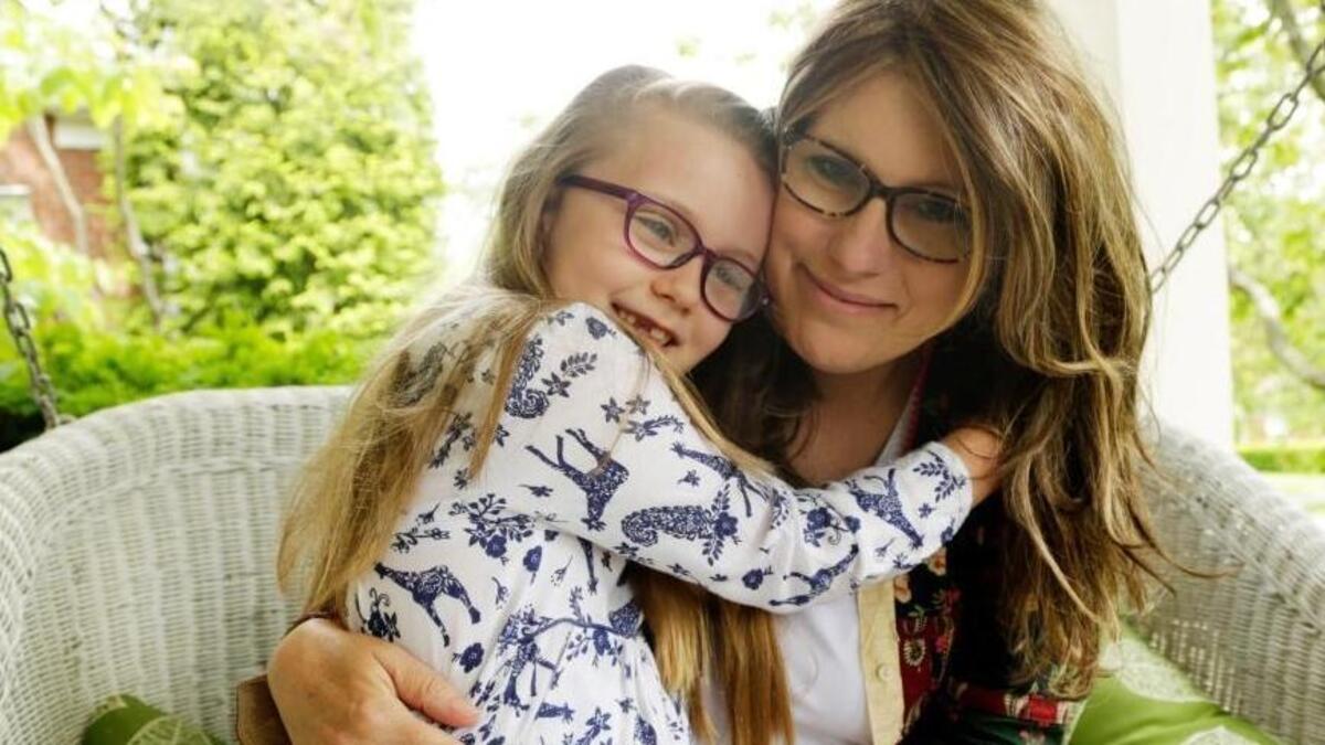 Kellee Edwards and her daughter, Kate Whitlock, 6, at their home in Lexington earlier this year. Kate attended Camp Kesem in Versailles, a weeklong camp for children with relatives who have cancer. Kellee Edwards died Nov. 9 in Lexington.