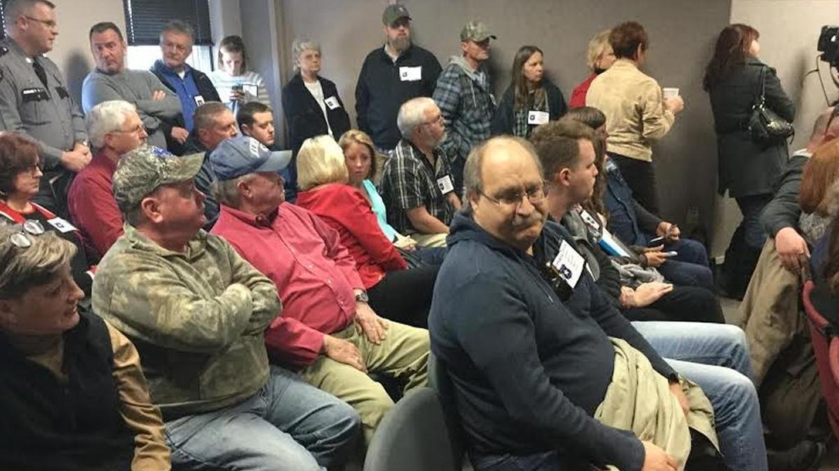 People packed the chambers of Paris City Commission during a disciplinary hearing Monday for five police officers charged with a variety of violations of policy.