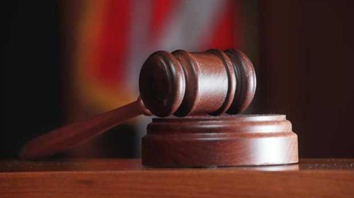 Teacher, a former NFL player, accused of harassing two female students