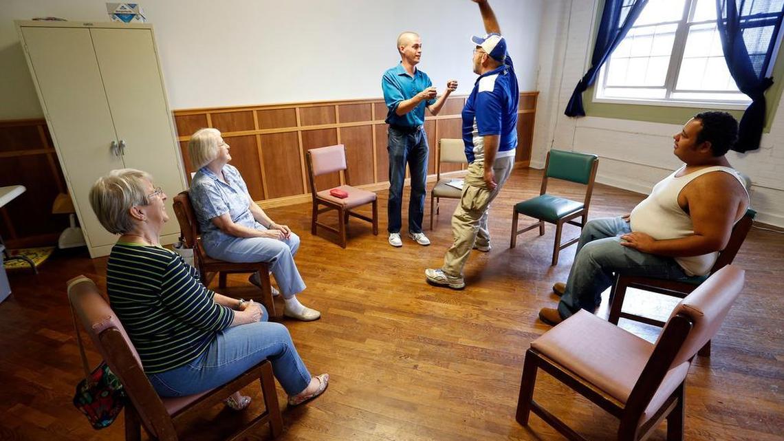 Ryan Bradney, standing left, worked with resident Steven Yeary, standing right, during an improv class held at the Clark County Homeless Coalition in Winchester. Ryan Bradney leads an improv group at the Clark County Homeless coalition with the players being the residents and volunteers. Bradney, who is also a pastor, volunteers to lead the weekly improv meetings which he uses to teach life skills and reduce anxiety but also helps folks in a stressful situation a chance to laugh and make others laugh.