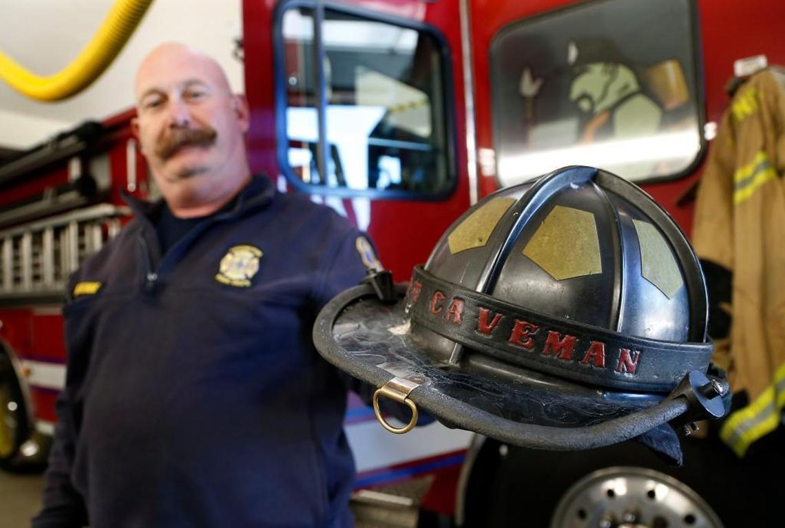 Lexington fire Capt. Paul Abercrombie with his “Capt. Caveman” helmet at Station 16.