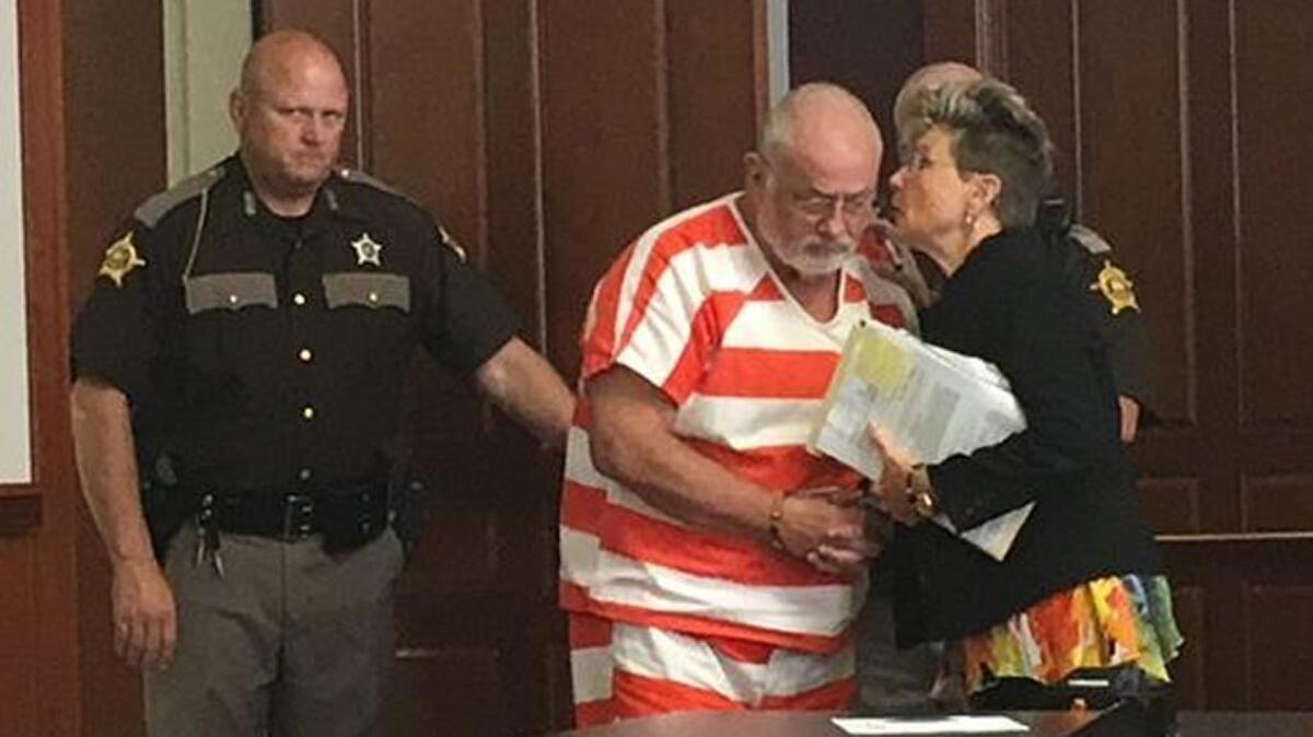 Tim Nolan listened to his attorney, Margo Grubbs, in court on June 12, 2017.