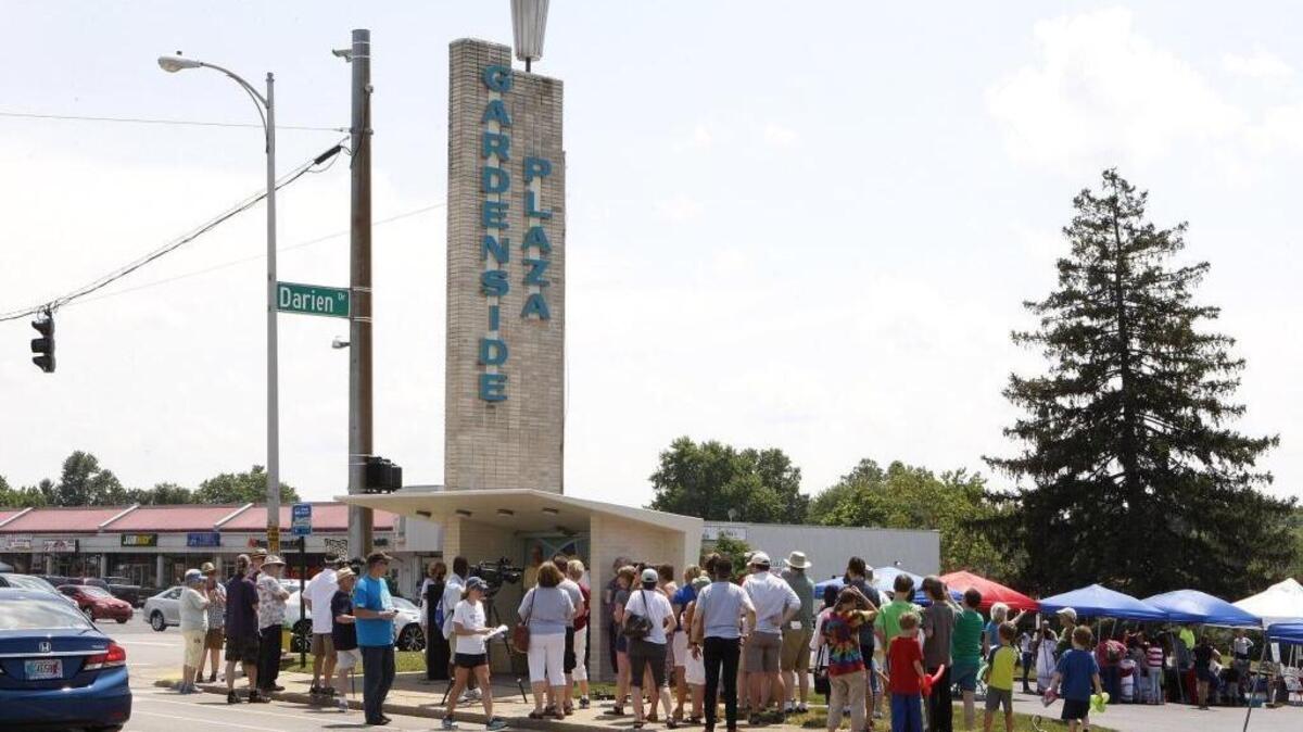 Folks gathered to celebrate the restoration of the iconic 1959 bus shelter with new period-appropriate ceramic mural by Guy Kemper at Gardenside Shopping Center at the intersection of Alexandria and Darien drives in Lexington, Ky., Sunday, June 26, 2016.
