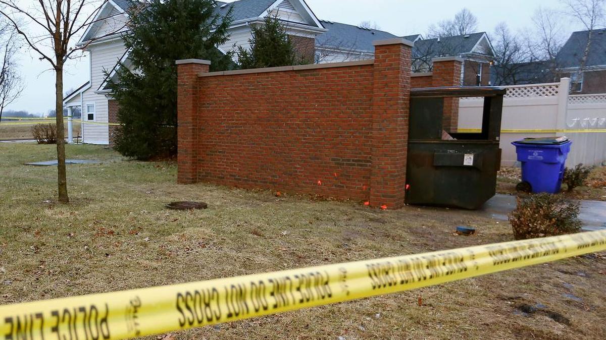 Crime scene tape remained at the scene of a fatal shooting at The Shropshire apartments on East Sixth St. near Shropshire Ave. At about 4 a.m. Wednesday, a 19-year-old man was found shot behind a garbage dumpster at the complex. Police are investigating the death as a homicide.