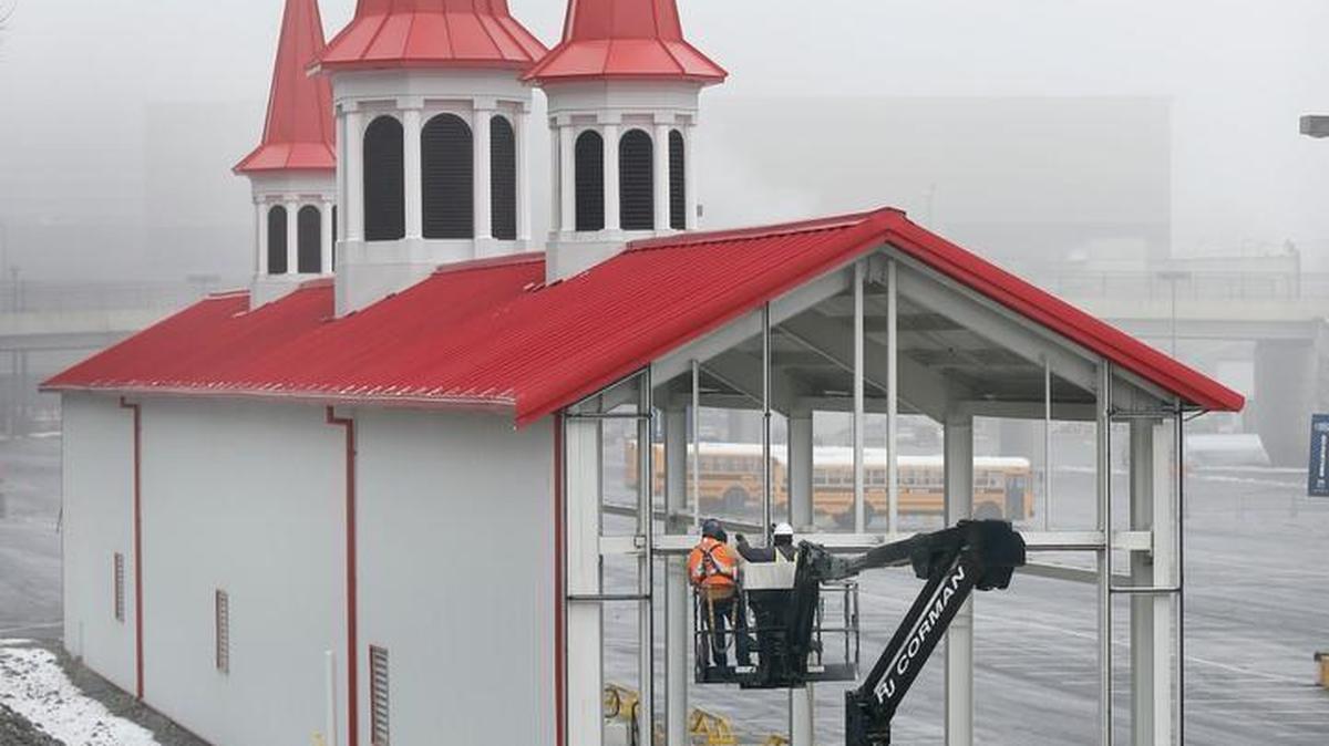 Steve Simmons, left, and Julio Santo of O’Nan Glass and Window Co. worked Wednesday to disassemble the building that housed the R.J. Corman Railroad Co. steam locomotive “Old Smoky.” The glass-walled structure with red Churchill Downs-like spires was erected in 2012. The company agreed in 2014 to disassemble the building as part of a settlement of a lawsuit with Lexington Center Corp.