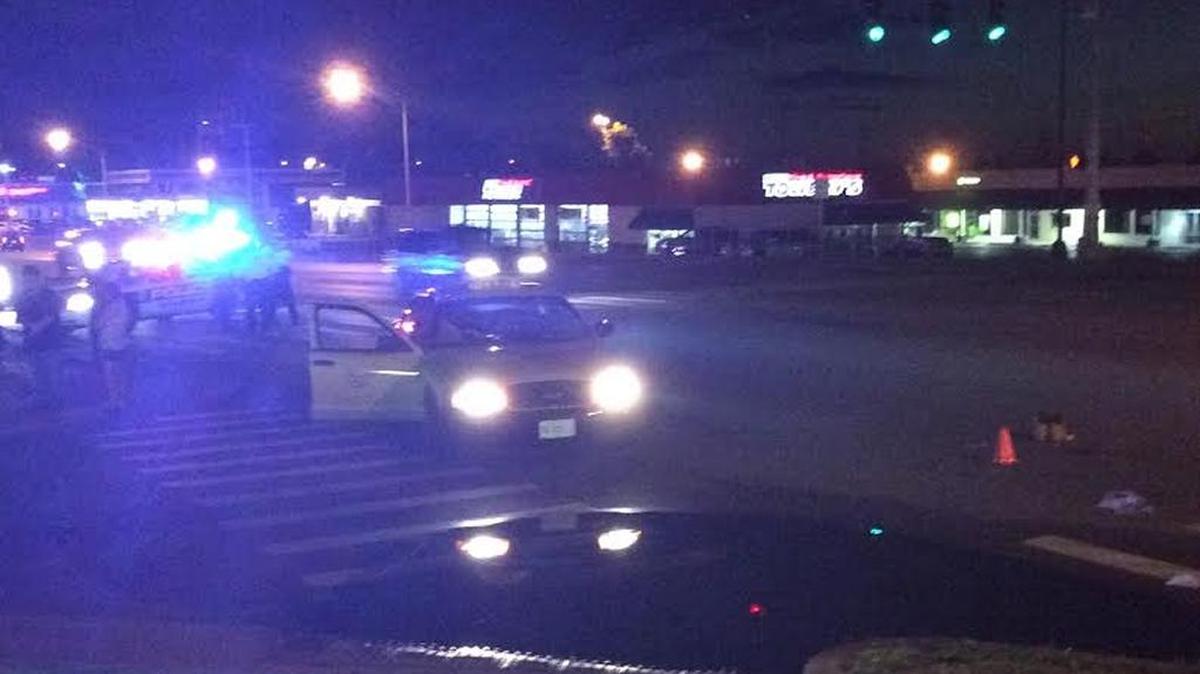 A pair of men’s boots sat at the intersection of Winchester Road and Ashton Drive, where a pedestrian was hit by a taxi Tuesday night. Police said he was crossing against the light.