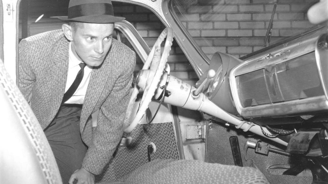 Detective Don Duckworth looked over the front of Betty Gail Brown’s car in October 1961 after Brown was found strangled inside her French Simca car in front of Old Morrison Hall at Transylvania University.