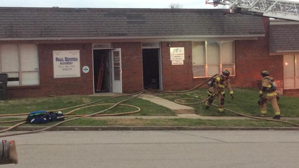 Firefighters worked at the scene of a fire that damaged an auto body shop on Werne Drive.