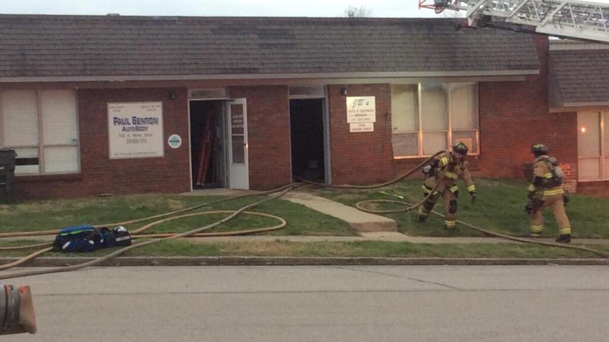 Firefighters worked at the scene of a fire that damaged an auto body shop on Werne Drive.