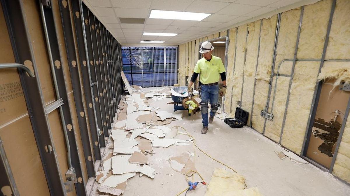 Casey Creek Construction superintendent Travis Gilpin was overseeing remodeling Tuesday at a former city building at 1055 Industry Road, which will become a 24-hour homeless shelter for Lexington.