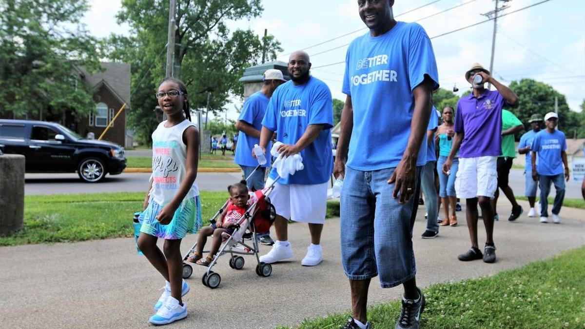 Marchers arrived at Douglass Park for the 13th Annual Father’s Day Family Celebration.