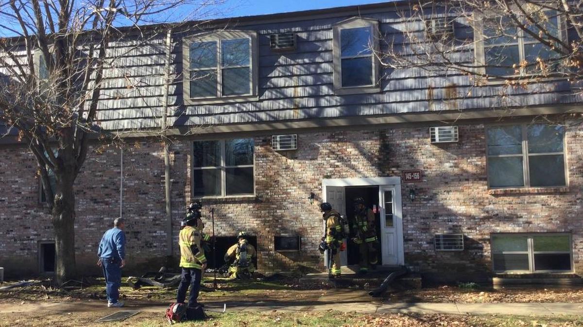 Lexington firefighters worked outside a basement apartment that burned Tuesday. The apartment where the fire started had serious smoke, fire and water damage.