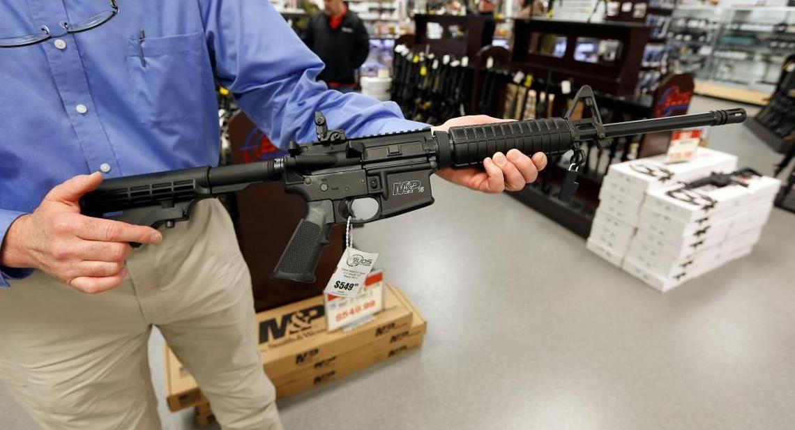 Employee Doug Ramsey held a Smith & Wesson M&P 15 Sport II, an AR-15 pattern firearm, at Buds Gun Shop & Range, 1105 Industry Road in Lexington. The largest online gun retailer in the country has said they don't plan to stop selling assault style rifles.
