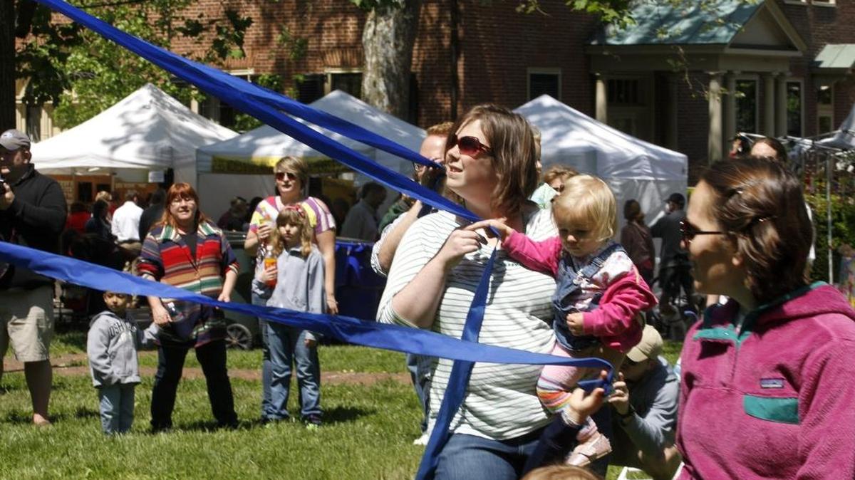 Dancing around the maypole is always a popular event during Mayfest at Gratz Park.