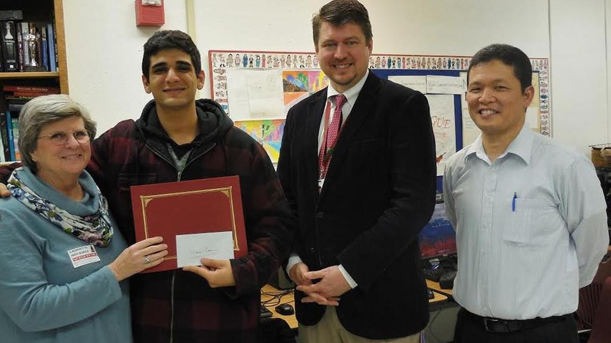 Christine Sieber, left, League of Women Voters’ board member; Waleed Ibrahim, a senior at Lafayette High School and winner of the special recognition for English Language Learners from the league’s essay contest; David Scholl, associate principal at Lafayette; and Tim Mitsumori, English Language Learners teacher at Lafayette.