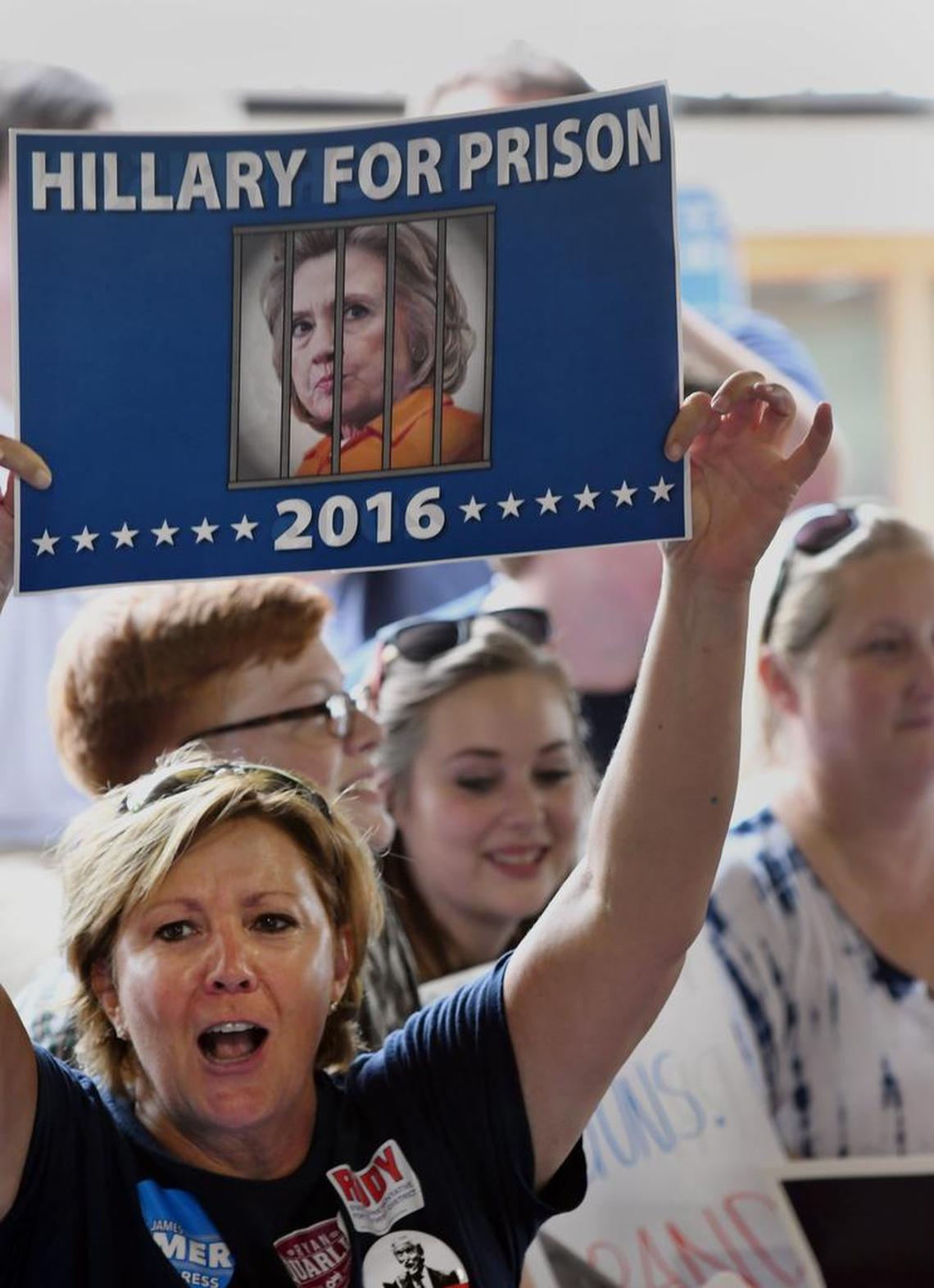Phyllis Sparks, of Walton, held up her sign on the GOP side of the audience.