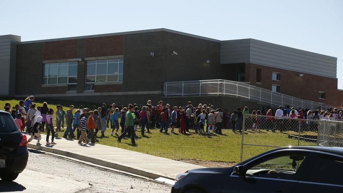 In this October 2013 file photo, teachers guided Tates Creek Elementary students back into the building after evacuating for a small fire cause by construction. No one was injured. On Wednesday, Tates Creek students were again evacuated while police officers and firefighters dealt with a suspicious package.