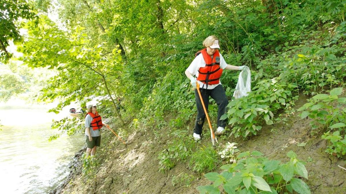 Ellen Hannifan, left, and Sue Skelly, right, collected trash along the banks during the annual Kentucky River Clean Sweep in 2013. This years’ sweep is on Saturday.