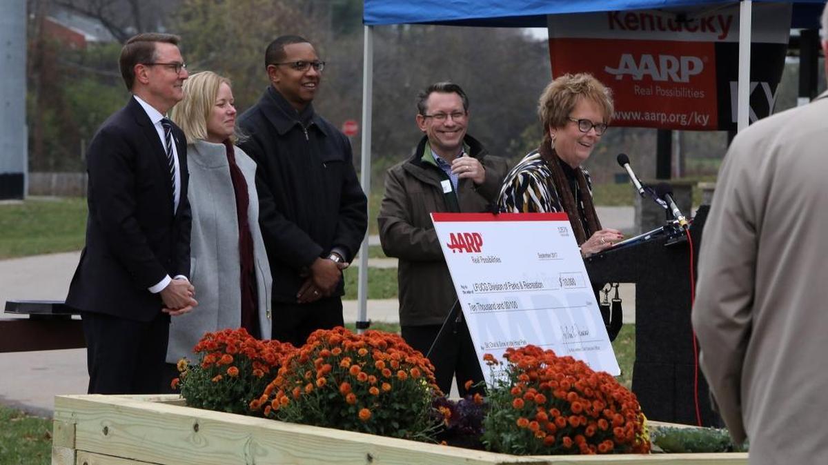 Charlotte Whitaker, president of Kentucky AARP, spoke Monday at the unveiling of a new raised bed planter and two benches at Idle Hour Park next to the Lexington Senior Center.