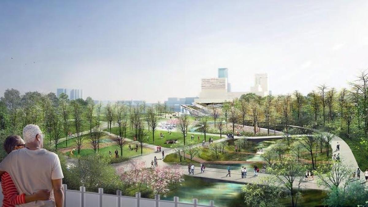 An artist’s rendering of Town Branch Park as seen from the Oliver Lewis Way bridge. The smaller bridges are crossing Town Branch Creek, which would be restored as a stream.
