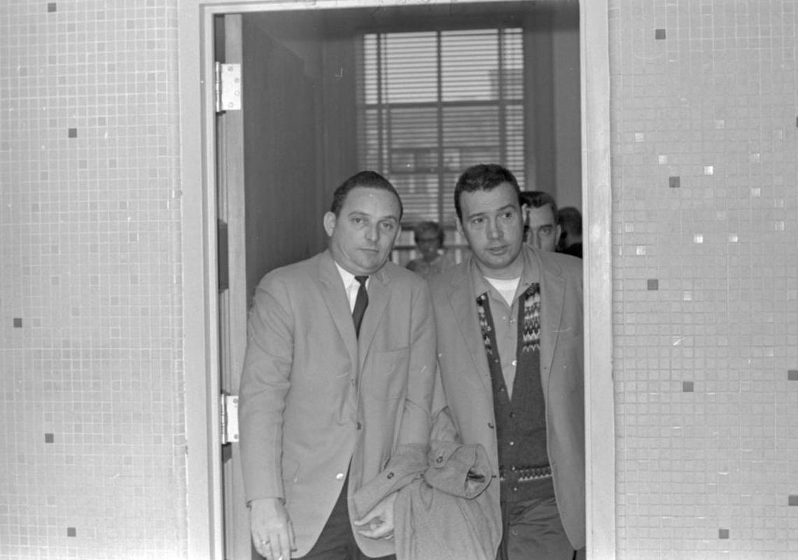 Lexington police Lt. Robert Robinson, left, escorted Alex Arnold Jr., out of the Fayette County courthouse in February 1965 after a hearing. Arnold had claimed that he killed Betty Gail Brown in October 1961.