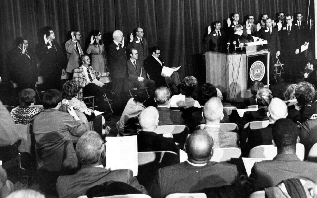 Fifteen members of the first Lexington-Fayette County Urban County Council is sworn in, Jan. 1, 1974. Pam Miller, fourth from left, was the first woman elected to the newly formed council.