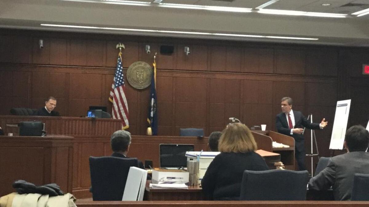 Albert Grasch Jr., right, an attorney for American National University of Kentucky, presented his opening statement Monday at the start of a trial. The state attorney general’s office has accused the for-profit school of violating the Kentucky Consumer Protection Act. At left is Fayette Circuit Judge Thomas Travis.