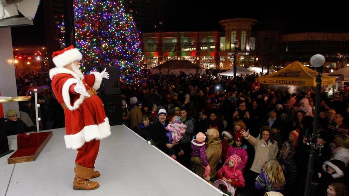 Santa Claus says goodbye to the crowd after the city tree lighting at Triangle Park in Lexington last year.
