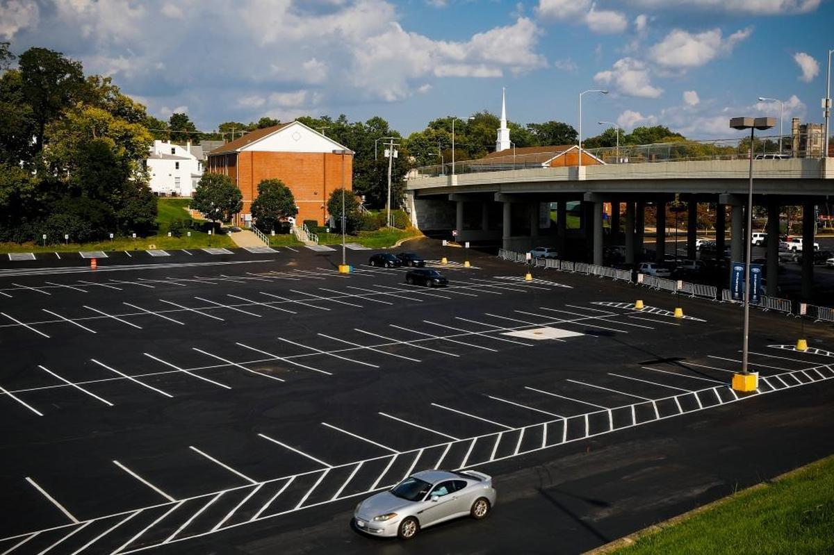 A car drives through the parking lot behind Main Street Baptist Church near the Jefferson Street Bridge in Lexington.
