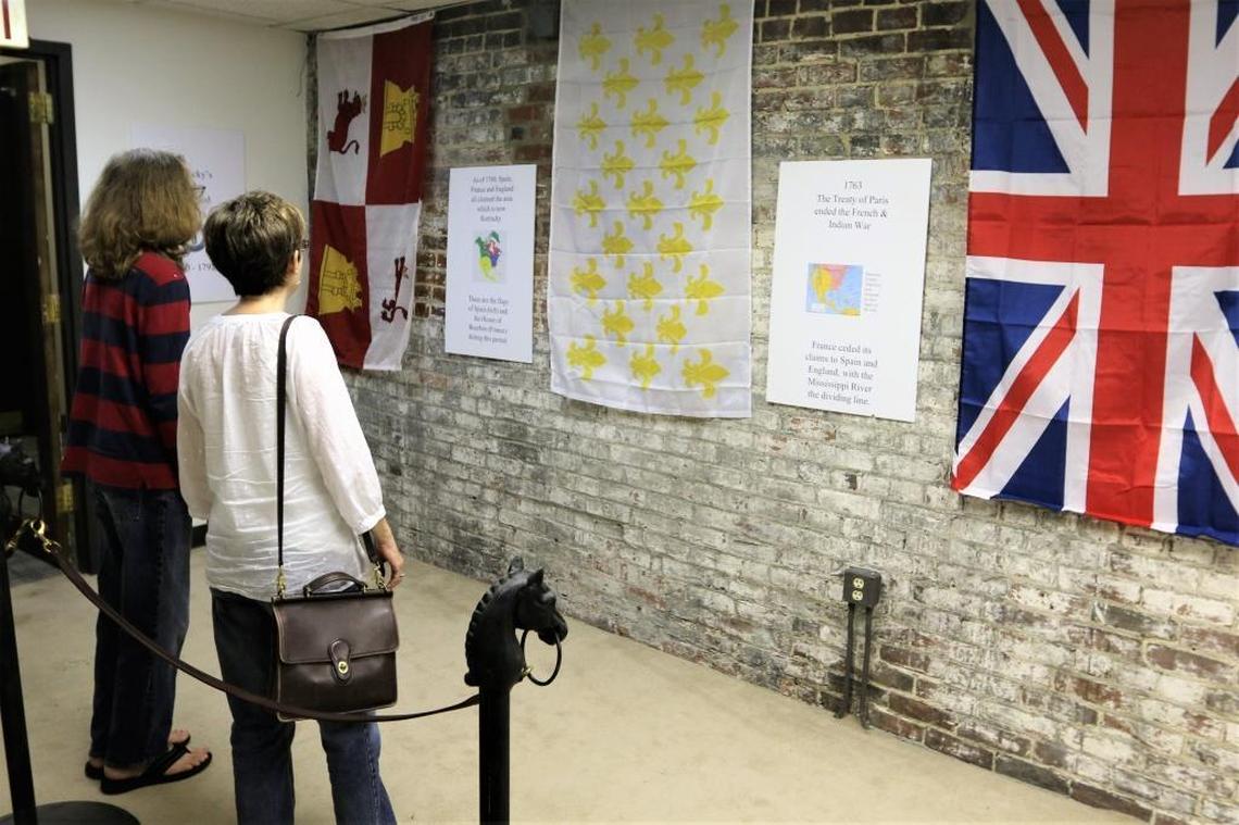 Lauren and Lewis Glasscock, mother and son, of Lexington, viewed some of the historic flags on displa May 19 at Lexington History Museum’s Pop-Up Exhibit at Victorian Square in downtown Lexington.