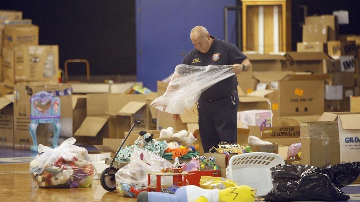 Captain Dennis Sturt sorted toys that had been donated to the Lexington Fraternal Order of Firefighters’ toy drive in 2008.