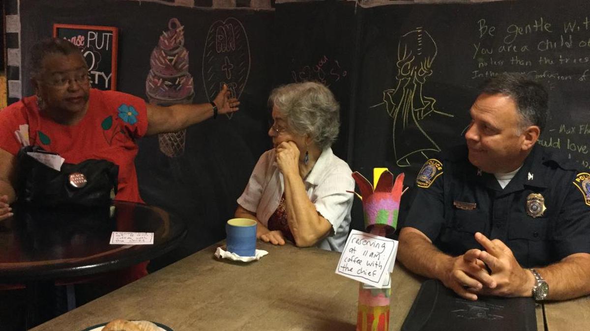 Marilyn Dishman, left, made a point as Anne Wood and Lexington Police Chief Mark Barnard listened during Friday’s “Coffee with the Chief” session at Third Street Stuff.