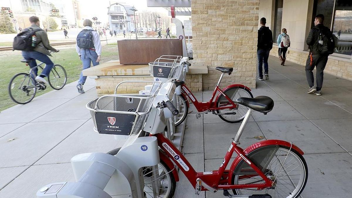 Ride-sharing bicycles sit in a BCycle bike rental station outside Union South on the UW-Madison campus in Madison, Wis. The university has 17 docks for bikes. The proliferation of more stations and bicycles has led to more rides this year for the bike-sharing Trek subsidiary.