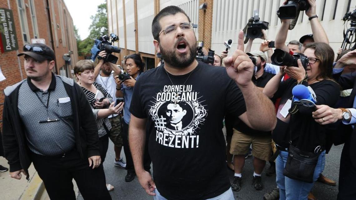 Matthew Heinbach, center, voices his displeasure at the media after a court hearing for James Alex Fields Jr., in front of court in Charlottesville, Va., Monday, Aug. 14, 2017.