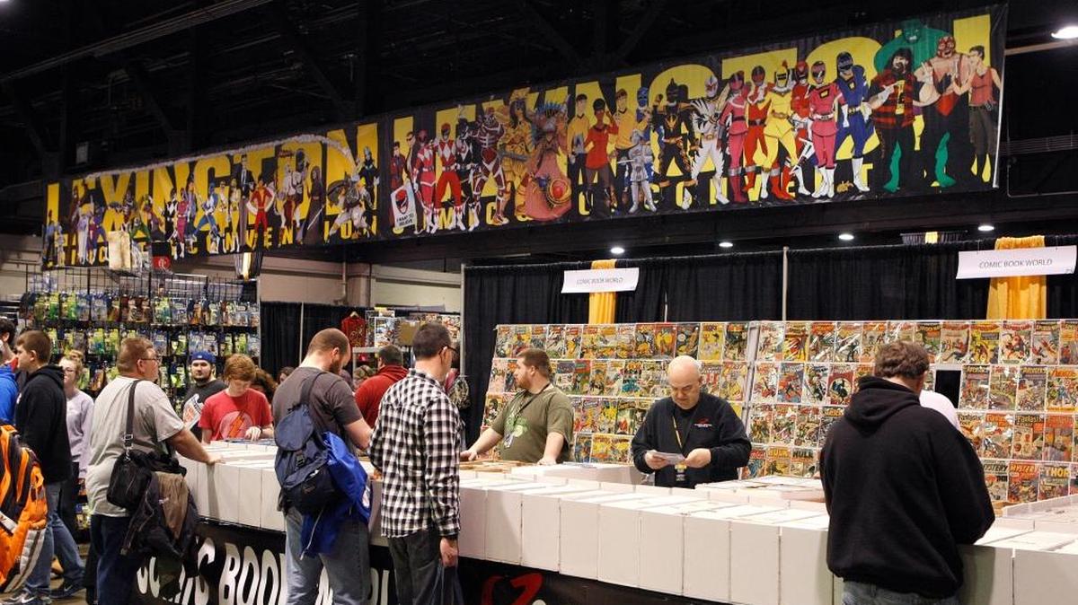 People peruse comic books in the Comic Book World booth at the Lexington Comic and Toy Convention in Heritage Hall at Lexington Center in Lexington March 14, 2015.