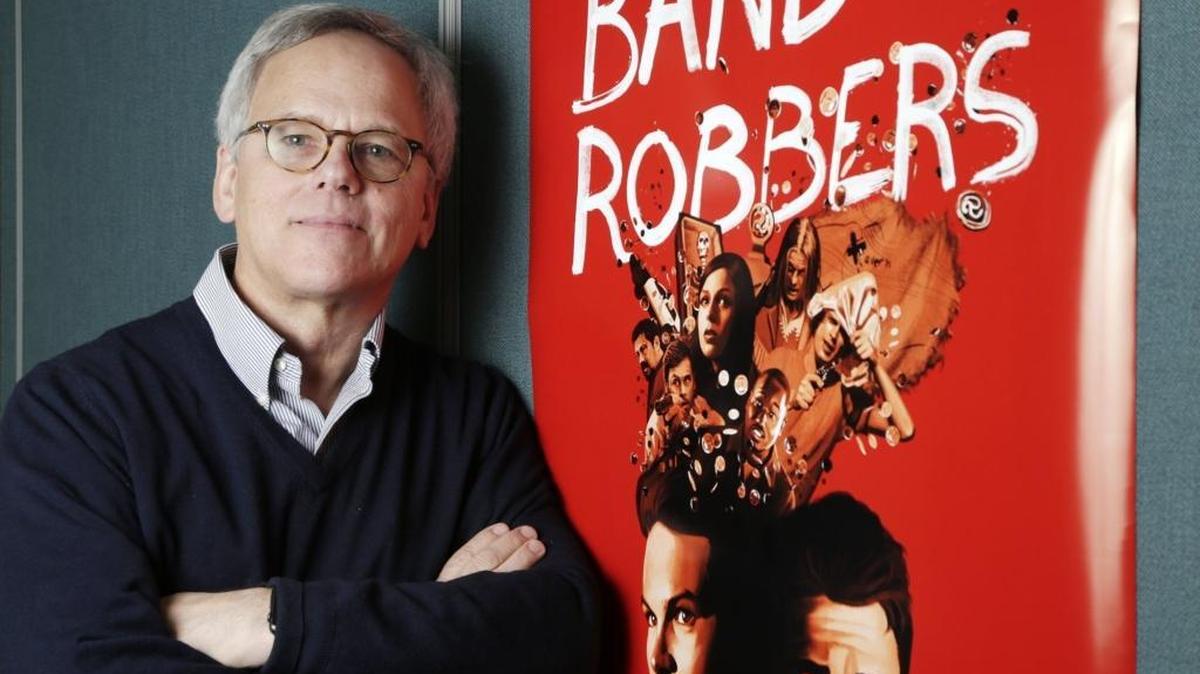 John Winn Miller posed with the poster for the movie he recently produced, “Band of Robbers.”